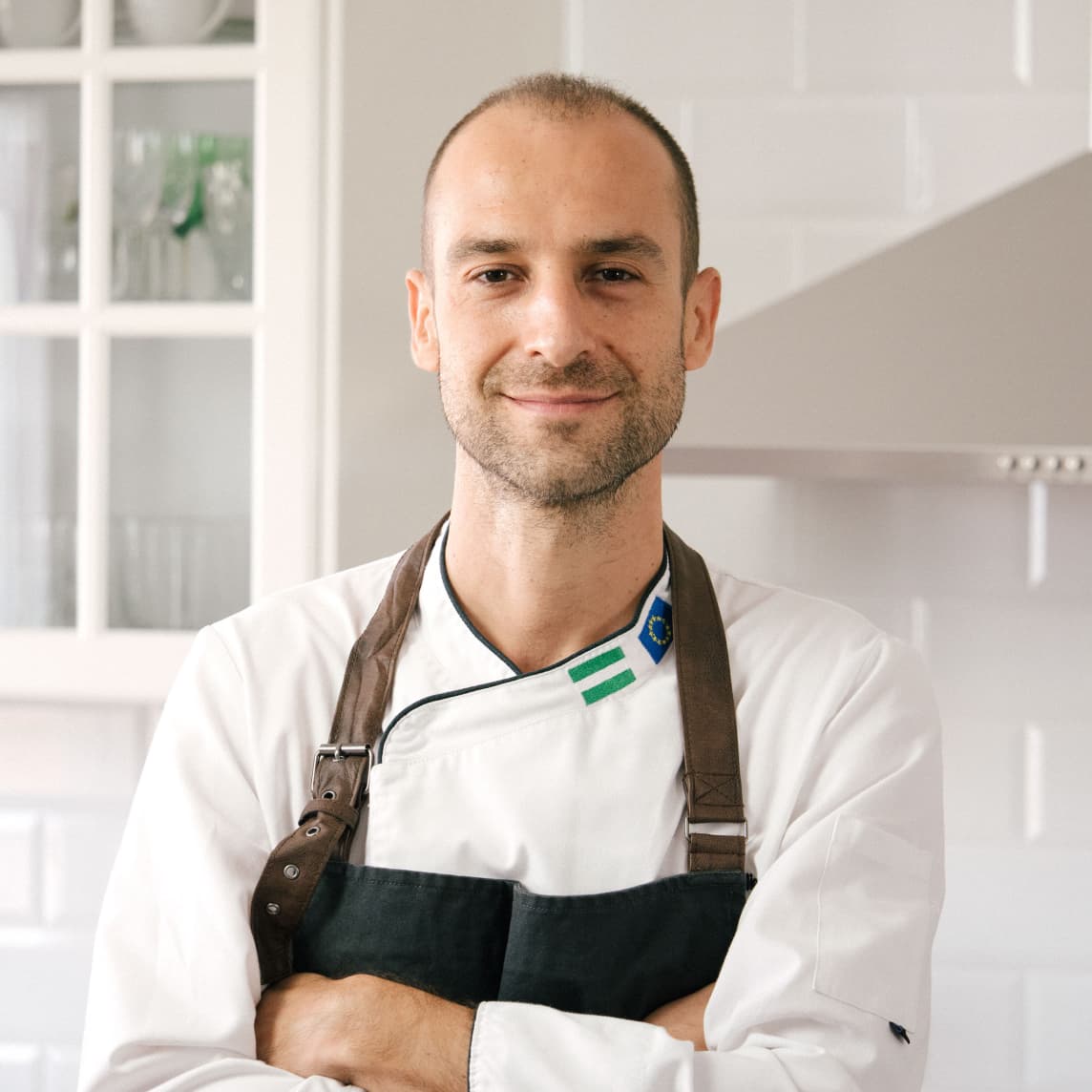 Chef Hugo Delgado preparing a dish in his kitchen